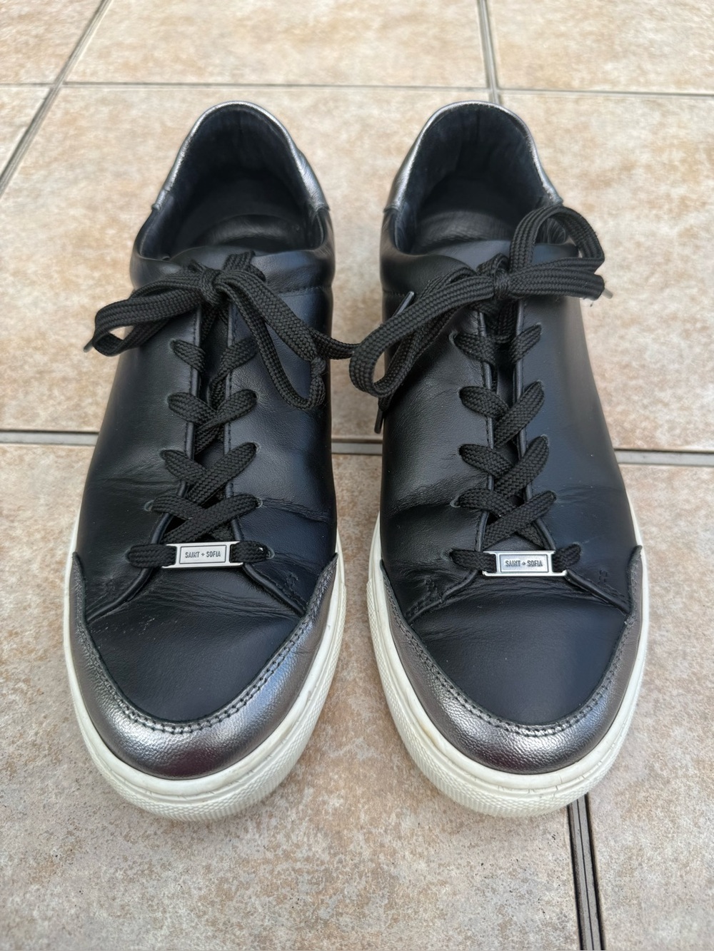 Saint + Sofia black leather low-top sneaker with "ROCK & ROLL" embroidered